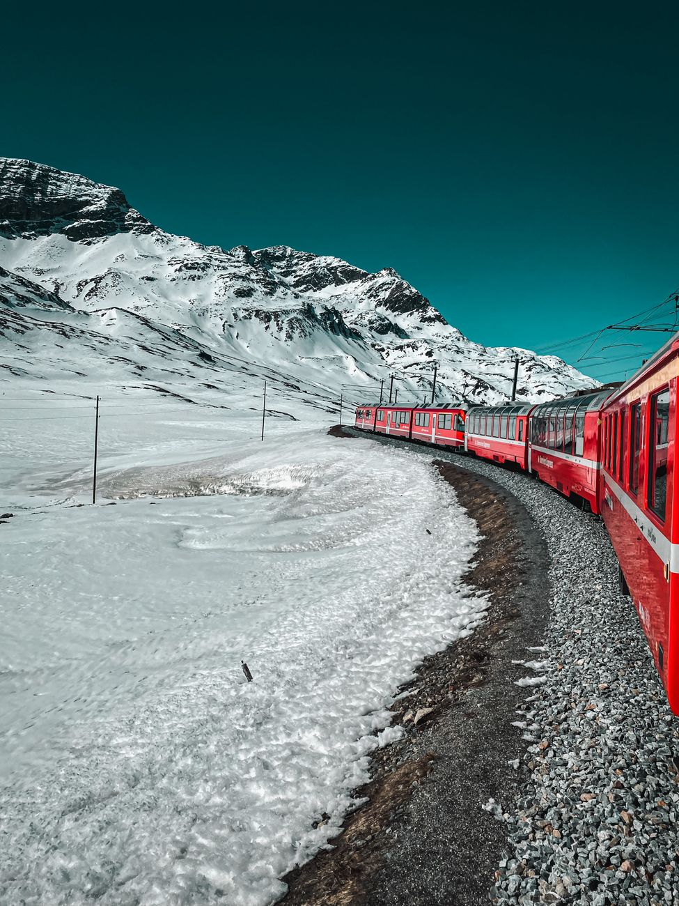 Swiss train in snow covered mountain pass